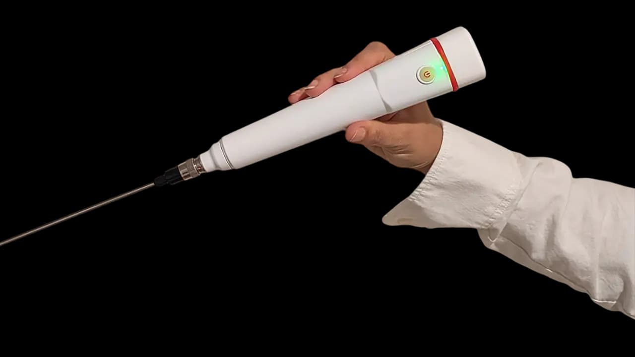 FREEVIEW wireless ENT endoscope — all-in-one system held in clinician's hand